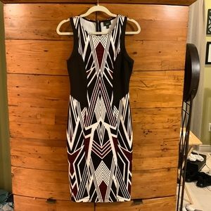 Super nice form fitting dress. Zip back. Polyester/Spandex blend.